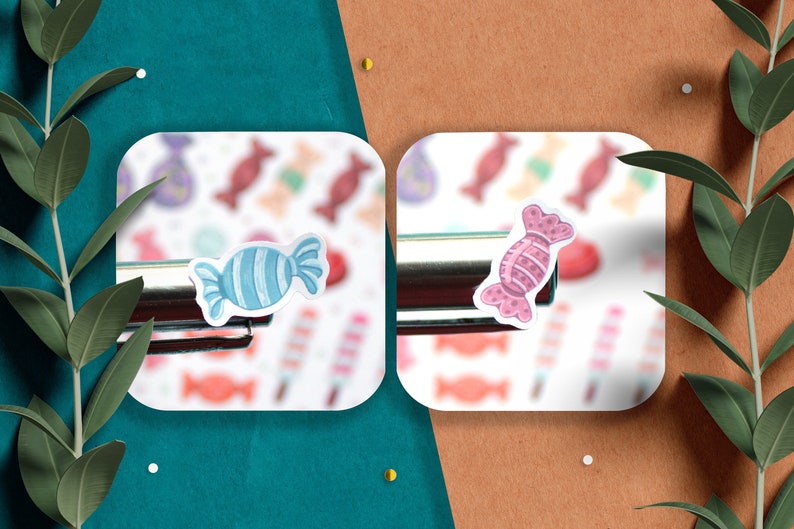 May include: Two candy stickers on a white background. The sticker on the left is blue and white with a swirl pattern. The sticker on the right is pink and white with a polka dot pattern.
