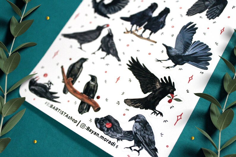 May include: A sheet of stickers featuring black crows in various poses, including flying, perched, and with a red berry in their beak. The stickers are on a white background with red dots and white stars.