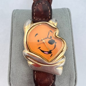 Vintage Timex Winnie the Pooh Watch - Disney Pooh Bear Watch - Gold Tone, with Brown Braided Leather straps.