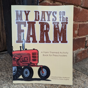 May include: A yellow book cover with the title "My Days on the Farm" in brown letters with a red tractor illustration. The book is a farm-themed activity book for preschoolers.