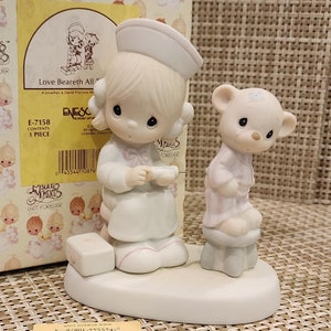 Vintage Precious Moments Figurines  “Love Beareth All Things&quot; with box (IOB) (Retired Figurine)