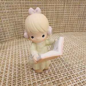 Vintage Precious Moments Porcelain Figurine “A Collection of Precious Moments&quot; (Retired Figurine)