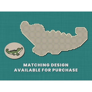 May include: A pixelated design of an alligator on a teal background. The design is outlined in white and filled with black dots. The text "MATCHING DESIGN AVAILABLE FOR PURCHASE" is below the design.
