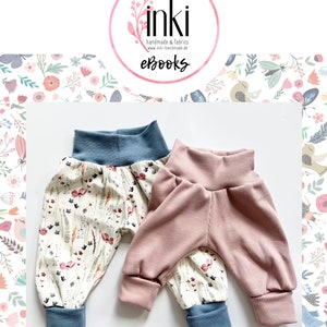 May include: Two pairs of pants with elastic waistbands and cuffs. One pair features a cream background with a multi-colored floral and botanical print, paired with blue cuffs. The other pair is solid dusty pink with a ribbed texture and blue cuffs.