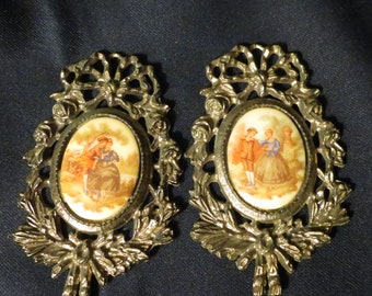 Set of Two Brooch type wall art  with ornate gold frame and oval shaped stone
