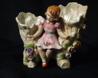 Vintage double vase with figurine between