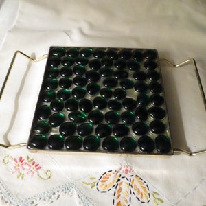 Mid century modern trivet with green glass mosaic