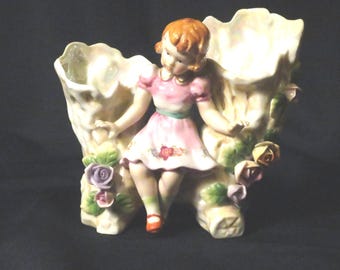 Vintage double vase with figurine between