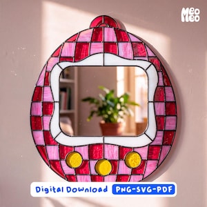 May include: An egg-shaped stained glass mirror featuring a checkerboard pattern of red and pink glass tiles. The center contains a rectangular mirror pane framed by white glass, with three yellow circular glass accents at the bottom. Text reads Meo Meo.