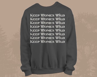 May include: A dark gray sweatshirt with the phrase "KEEP WOMEN WILD" repeated in white lettering.