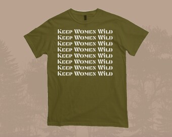 May include: A green t-shirt with the phrase "KEEP WOMEN WILD" repeated eight times in white text.