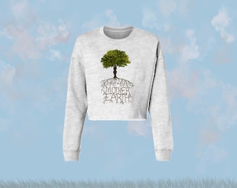 May include: A gray cropped sweatshirt with a graphic of a tree with roots that spell out "MOTHER EARTH".