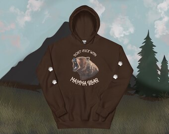 May include: Brown hooded sweatshirt with a graphic of a bear with the text "Don't f*ck with Mamma Bear" and paw prints on the sleeves.