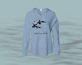 May include: Light blue hooded sweatshirt with a graphic of three orcas swimming and the text "Find Your Wild".
