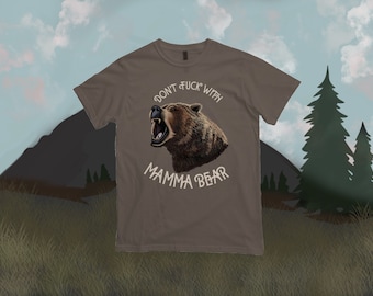 May include: A brown t-shirt with a graphic of a bear's head and the text "Don't Fuck With Mamma Bear".