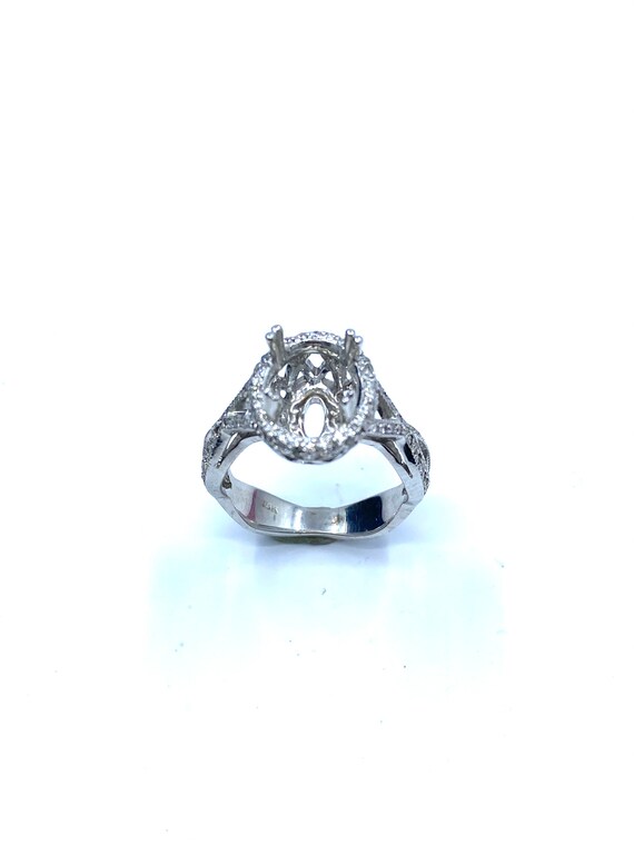 18 K W Gold Designer Diamond Engagement Ring w/ Twisted Shanks, Gold, 5.6 grams, TW of diamonds, 0.73 CT