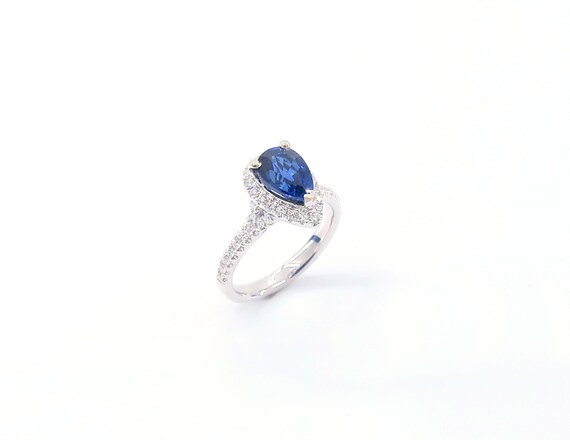 14 K White Gold Diamond Pear Shape Sapphire Ring Set on a One Row Halo