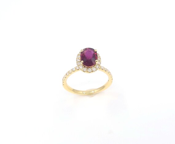 14 K Oval Ruby Shape Diamond Fancy Designer Yellow Gold Ring Featuring One Row Halo