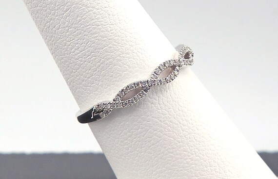 14 K W Gold Diamond Wave Band, Gold, 1.5 grams, TW of diamonds, 0.20 CT