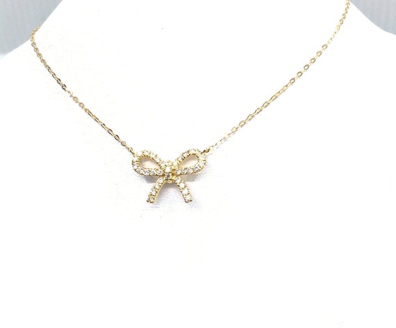 18 K Y Gold Bow Necklace, TW of diamonds, 0.43 CT