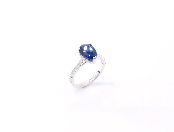 14 K White Gold Diamond Pear Shape Sapphire Ring Set on a One Row Halo Underneath