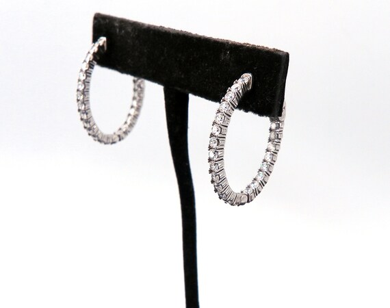 14 K Oval Shaped White Gold Hoop Earrings featuring Inside Outside Diamonds with Special Lock