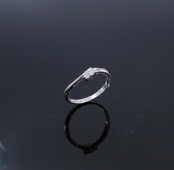 Platinum 900 By-pass Style Diamond Band / Ring, Platinum, 3.4 grams, TW of diamonds, 0.16 CT