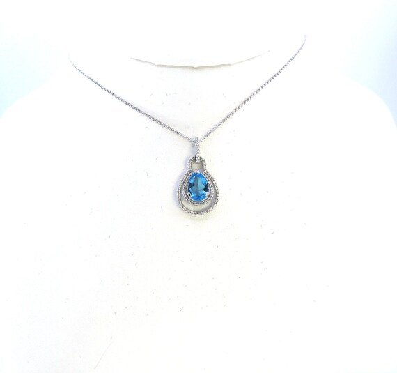 14 K Blue Topaz Pear Shaped Pendant w/ Double Row Hale Frames, Gold, 4.12 grams, TW of diamonds, 0.32 CT