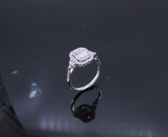 18 K White Gold Diamond Engagement Ring featuring Center Cluster of Baguettes in a Halo