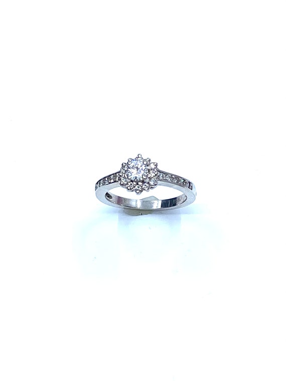 18 K White Gold Classic Diamond Engagement Ring featuring One Row Halo