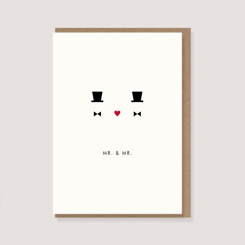K&ouml;nnte beinhalten: Hochzeitskarte mit minimalistischem Design. Die Karte zeigt zwei schwarze Zylinder, Fliegen und ein rotes Herz, mit dem Text "MR. & MR." in einer einfachen Schriftart. Die Karte ist vor einem wei&szlig;en Hintergrund mit braunem Rand.