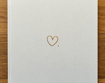 Heart - handmade wedding guest book with elegant linen cover and gold embossed motif