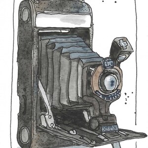 May include: Watercolor illustration of a vintage Kodak camera. The camera is primarily gray and black with a brown lens and a bellows design. The word "Kodak" is visible on the front. The image is framed with a black border.