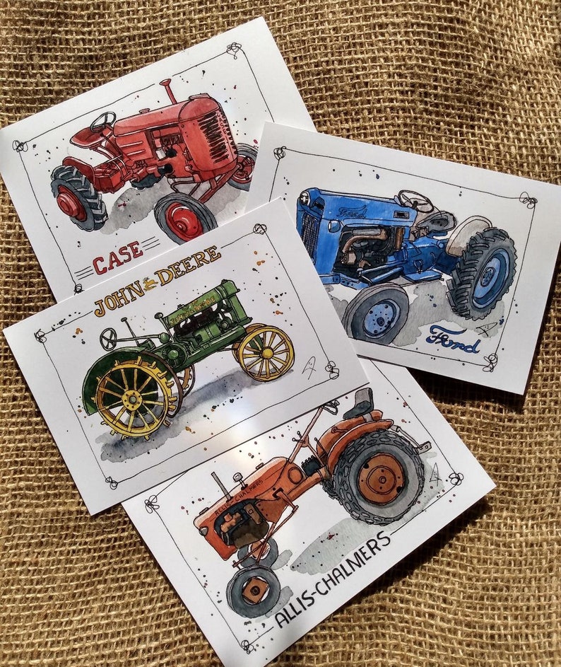 May include: Four watercolor art prints featuring vintage tractors. The prints showcase a red Case tractor, a blue Ford tractor, a green John Deere tractor, and an orange Allis-Chalmers tractor. Each print has the tractor's name.