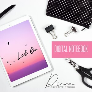 May include: A white tablet displays a sunset scene with the words "Let Go" and flying birds. The image is surrounded by a black and white polka dot pouch, binder clips, and scissors. The text "DIGITAL NOTEBOOK" is in a pink rectangle.