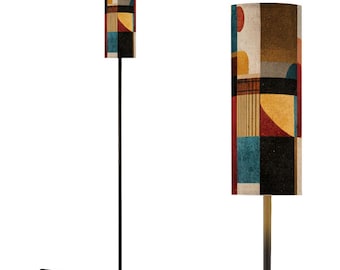 May include: A tall, black floor lamp with a cylindrical lampshade. The lampshade features a geometric pattern in shades of brown, red, yellow, blue, and black. The lamp has a round base and a foot switch.