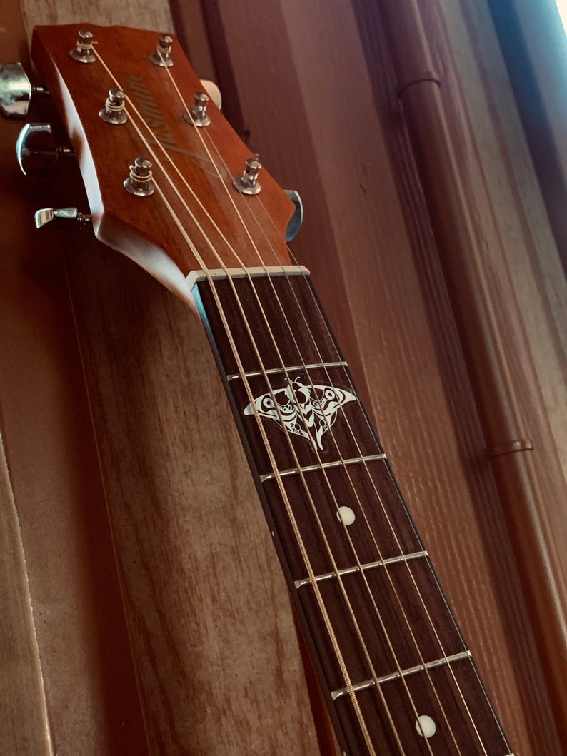 Ellie's Guitar Moth Vinyl Sticker The Last of Us Part II image 1