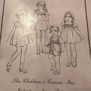 May include: A vintage sewing pattern titled "English Smocking" featuring illustrations of children in smocked dresses and overalls. The text "The Children's Corner, Inc. Instructions, Ideas, Patterns" is also visible.