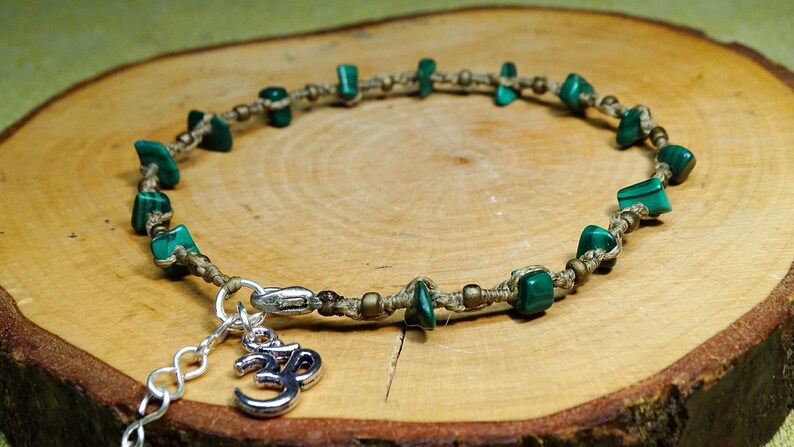 handmade macrame foot chain with semiprecious stone shards and om sign in beigelight brown anklet