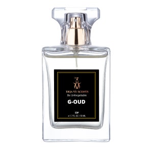 May include: A clear glass bottle of perfume with a gold cap and a black label that reads "DEJA VU SCENTS Be Unforgettable G-OUD EDP e 1.7 FL OZ/50 ML".
