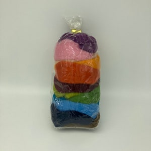 May include: A plastic bag filled with eight different colors of wool roving. The colors are purple, pink, orange, brown, green, blue, dark blue, and brown.