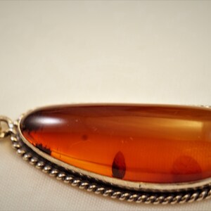 A-grade Baltic Sea Amber in Vintage Sterling Silver Handcrafted Pendant w/ Spiral Accents_ Long Free Form Shape Natural, Cognac Color