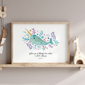 May include: A watercolour illustration of a narwhal with a gold horn surrounded by colourful coral and seaweed. The text below reads "When you go through deep waters I will be with you - Isaiah 43:2".