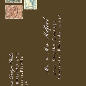May include: A brown envelope with three vintage postage stamps and an address written in white cursive. The address reads "Mr. & Mrs. Mulford, 2123 Shelby Cottage, Sarasota, Florida 34236".