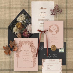 May include: A blush pink wedding invitation suite with a floral border in copper foil. The invitation features the couple's names and wedding date. The RSVP card includes a floral design and a section for guests to indicate their meal preference. The menu card features a copper foil floral wreath with the couple's initials and the word "Details".