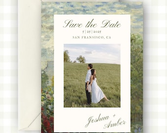 May include: Wedding invitation with a landscape painting background and a photo of a couple in a field. The text reads "Save the Date" with the date and location, and the names "Joshua + Amber". The invitation is in an envelope.