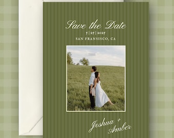 May include: Olive green Save the Date card with a photo of a couple in a field. The card includes the date, location, and names Joshua and Amber. An off-white envelope is included.
