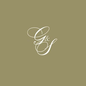May include: A white cursive script monogram with the letters "G & S" on a light brown background.
