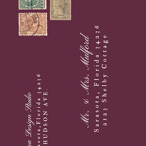 May include: A burgundy invitation design featuring vintage postage stamps and elegant white script. The text includes the names of Cierra Design Studio and Mr. & Mrs. Mulford, along with addresses in Sarasota, Florida.