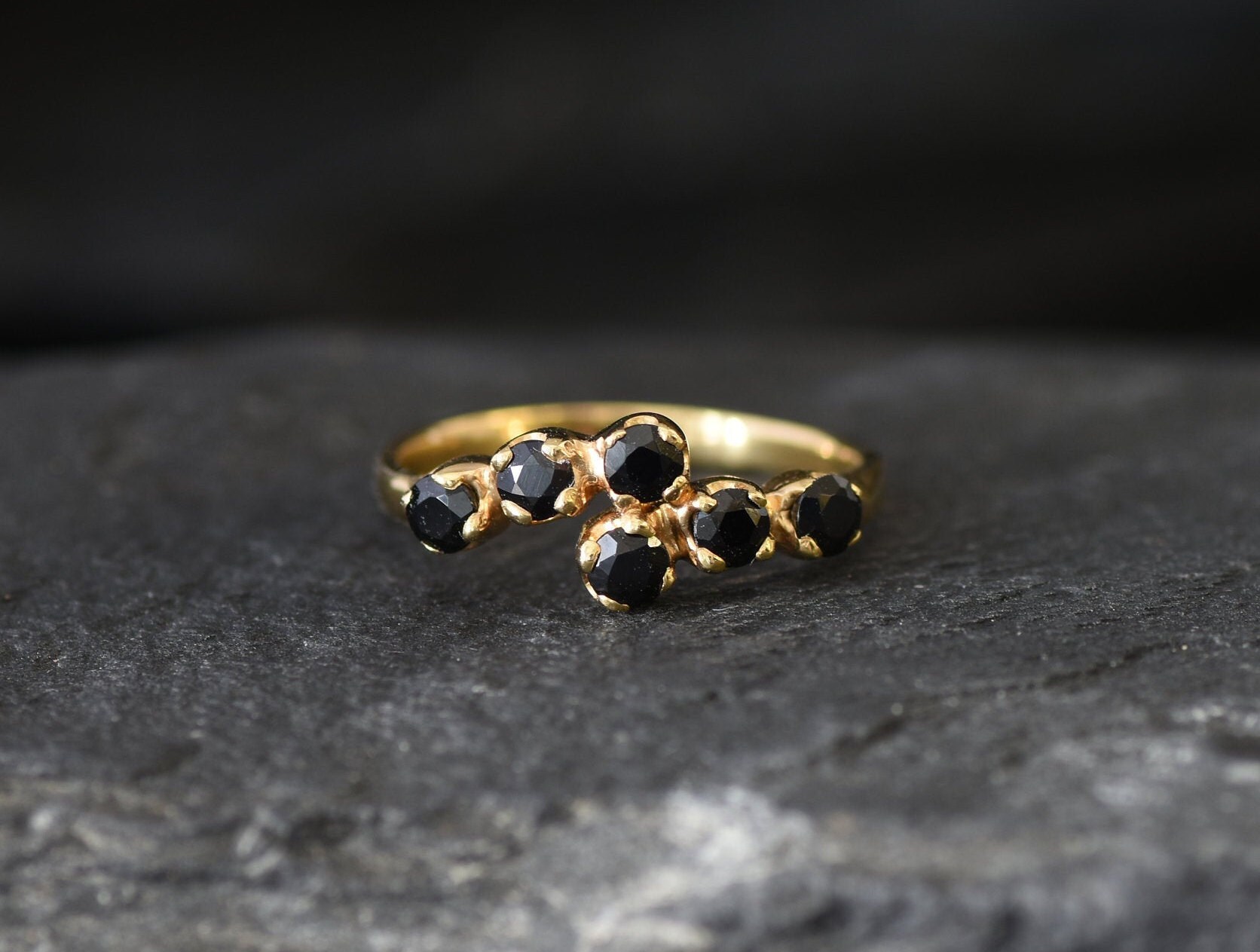 Gold rings shop with black stones